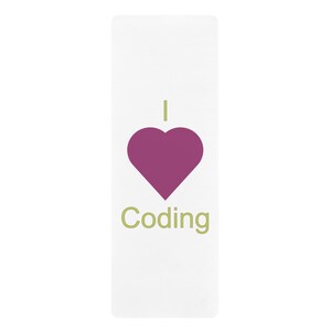 May include: A white yoga mat with the text "I love Coding" in green letters and a pink heart.