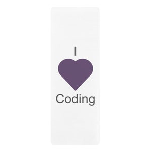 May include: A white yoga mat with the text "I heart Coding" in gray. A purple heart symbol is between the words "I" and "Coding".