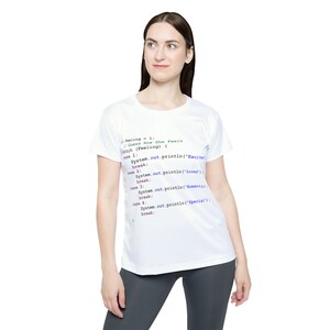 May include: White t-shirt with a code snippet printed on it. The code is written in Java and includes a switch statement with four cases. Each case prints a different string to the console. The code is written in a light blue, purple, and pink font.