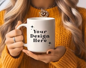 May include: A white ceramic mug with a black handle. The mug has the text "Your Design Here" printed on it with small stars on either side of the text.