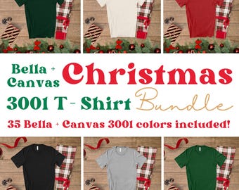 May include: A mockup of six different Bella + Canvas 3001 t-shirts in various colors, including green, white, red, black, heather grey, and dark green. The shirts are laid out on a wooden surface with red and white plaid fabric and Christmas decorations.