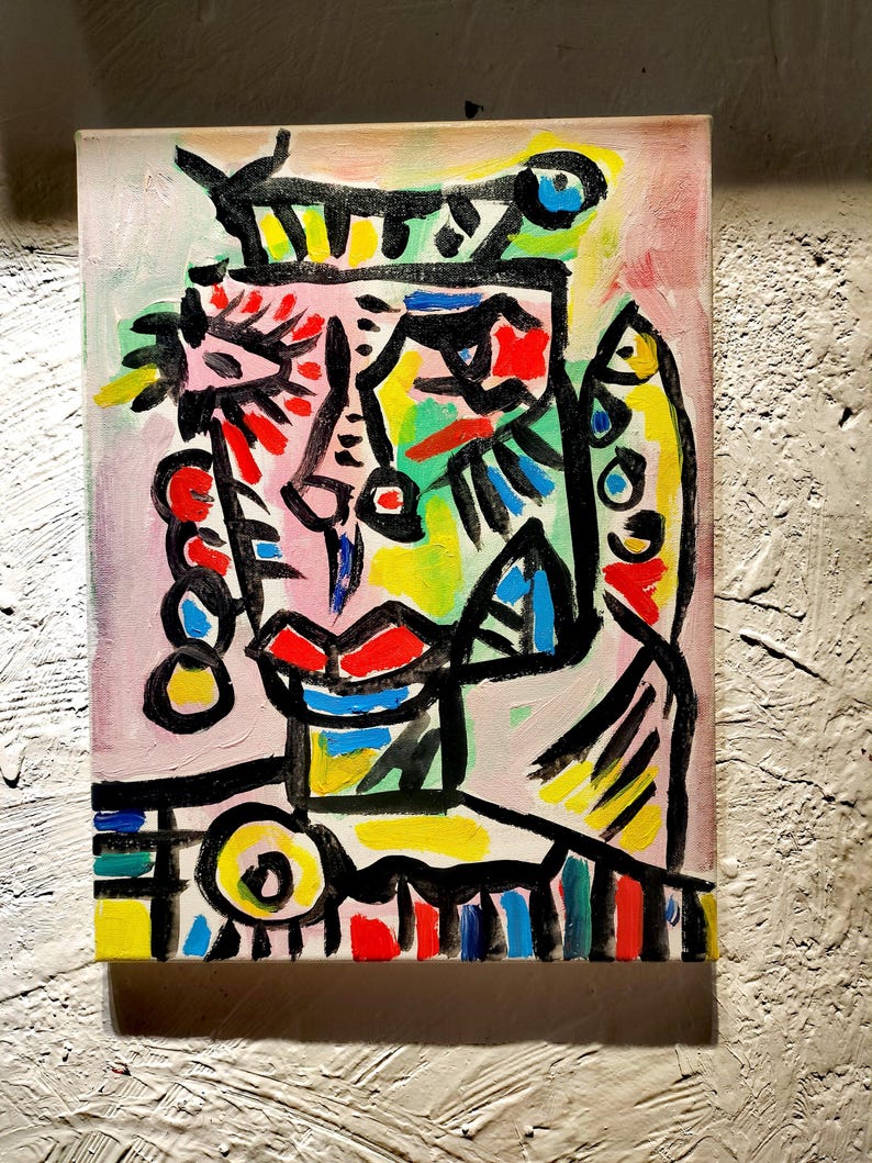 Puede incluir: Pintura abstracta de un rostro con l&iacute;neas negras audaces y colores brillantes, incluyendo amarillo, rojo, azul, verde y rosa.