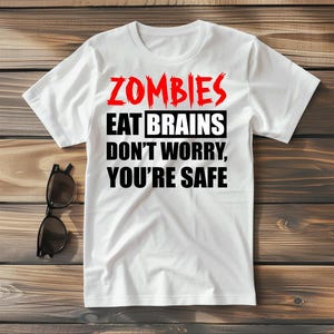 Funny Zombie T-Shirt I Zombies Eat Brains, Don't Worry You're Safe I Halloween Graphic Tee I Unisex Horror Shirt I Spooky Zombie Gift