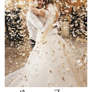 May include: A couple embracing while gold confetti falls around them. The text below reads Miles & Jess and the date 23.09.2025. The person on the left wears a white button-down shirt, and the person on the right wears a white lace wedding dress.