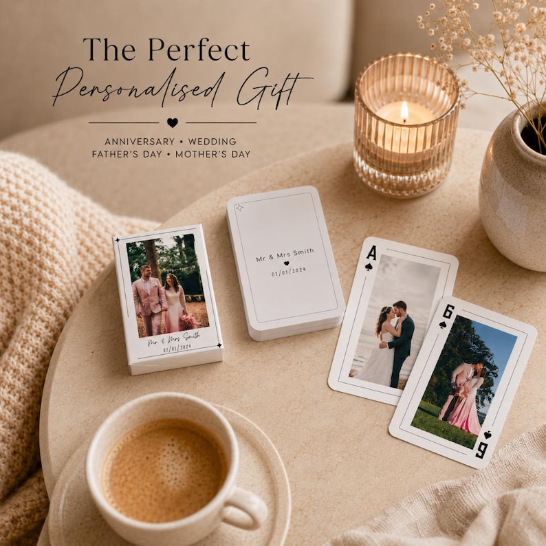 May include: A deck of custom playing cards featuring photographs of a couple on the box and individual cards. The box and cards are printed with the text Mr & Mrs Smith and 01/01/2024. The cards are displayed alongside a candle and a coffee cup.
