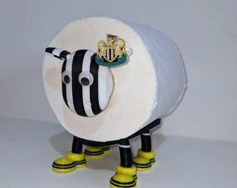 Newcastle United supporting Premier Sheep toilet roll holder customised NUFC football boots and toon army pin badge holder.