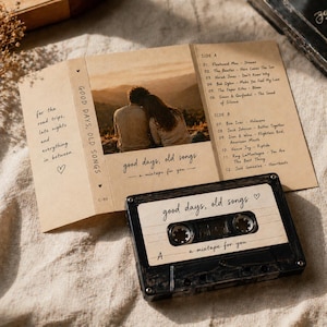 May include: A vintage cassette tape and a folded card with the text "good days, old songs" and a list of songs. The cassette tape is black with a white label. The card features a photo of a couple.