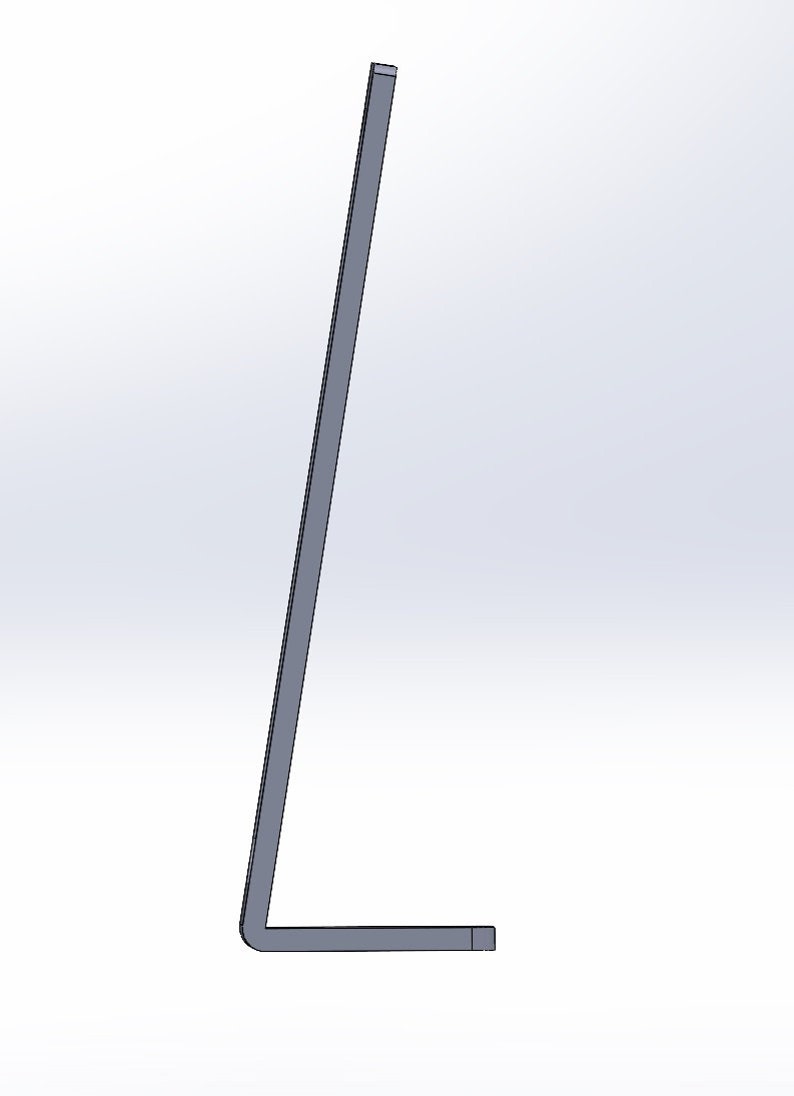 May include: A gray metal bracket with a right-angle bend. The bracket has a rectangular cross-section and is positioned against a white background. The design is simple and industrial.