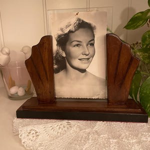Walnut-colored wooden photo frame in Art Nouveau style