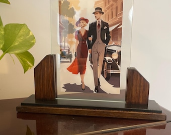 Art déco-fotoram i svart och valnötsträ med geometriska linjer