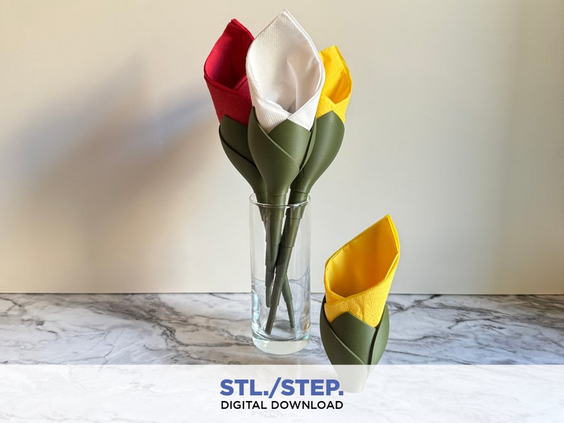 May include: Three paper napkin flowers in a clear glass vase on a marble surface. The flowers are made with white, red, and yellow napkins. The flowers are folded into a calla lily shape. The vase is on a marble surface. STL/STEP. DIGITAL DOWNLOAD.