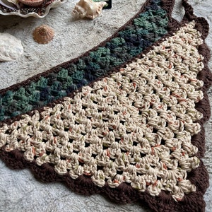 Detailed view of the handmade crochet work on the Aphrodite Shell Hair Bandana, highlighting the fine craftsmanship and unique shell edge. The color options are Forest and Harvest.