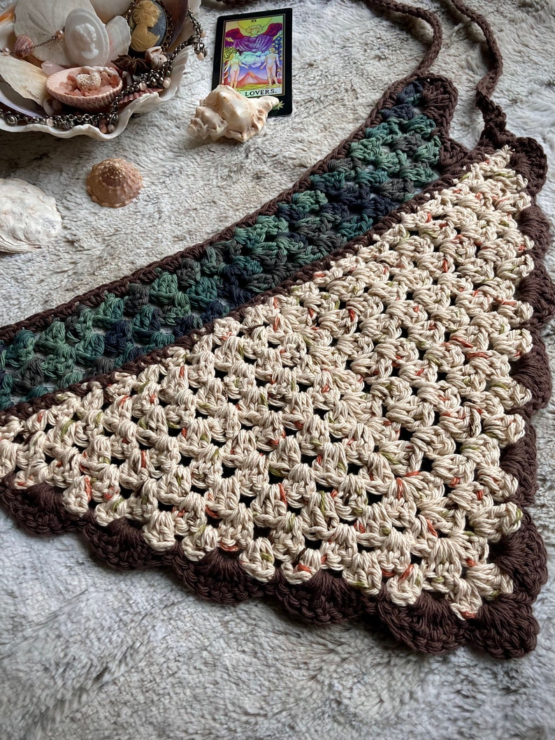 Detailed view of the handmade crochet work on the Aphrodite Shell Hair Bandana, highlighting the fine craftsmanship and unique shell edge. The color options are Forest and Harvest.
