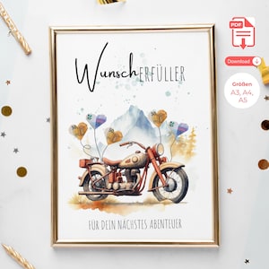 May include: A framed print featuring a vintage motorcycle illustration. The artwork includes the German text "Wunscherfüller" and "Für dein nächstes Abenteuer." The motorcycle is in shades of red and tan, with heart-shaped balloons. The background shows a mountain scene.