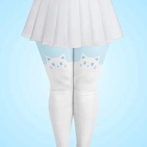 May include: A white pleated skirt paired with white leggings featuring a light blue background at the top and a repeating white cat face graphic pattern across the upper thigh area. The cat faces have simple blue eyes, noses, and whiskers.