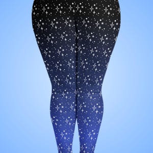 May include: Leggings with a celestial design. The leggings feature a gradient from black to blue, adorned with white stars of varying sizes. The overall effect is reminiscent of a starry night sky, creating a unique and eye-catching pattern.