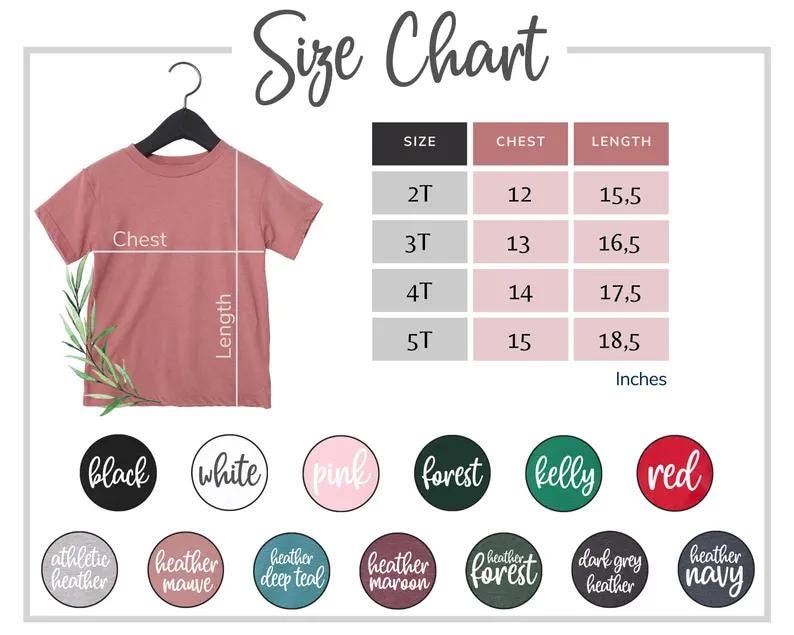 May include: A size chart for a children's t-shirt, with measurements in inches. The chart includes chest and length measurements for sizes 2T to 5T. Color options are displayed in circular labels: black, white, pink, forest, kelly, and red.