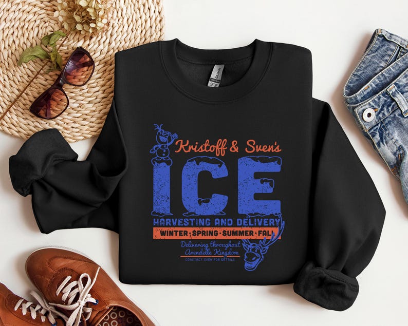 May include: Black crewneck sweatshirt with the text "Kristoff & Sven's ICE" in blue and orange. The graphic includes a snowman and reindeer, with the words "Harvesting and Delivery" and "Winter, Spring, Summer, Fall".