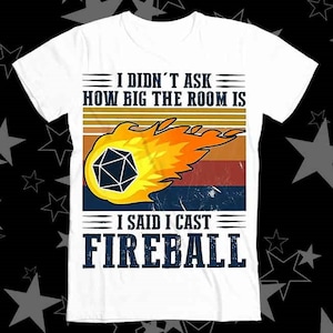 May include: White t-shirt with a vintage-style graphic of a fireball with a dice inside. The text reads "I didn't ask how big the room is I said I cast Fireball".