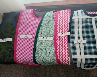 Extra Large Bibs for Seniors  in Multiple themed patterns.  Hand made, double sided w/different patterns and accent edge binding