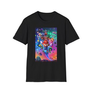 Black Super Mario Galaxy inspired graphic t shirt featuring a colorful cosmic space themed design with a classic platform hero flying through a vibrant galaxy environment surrounded by stars planets and whimsical characters. The shirt is displayed flat showing the full front graphic print on a Gildan 64000 softstyle tee. The bright game inspired artwork captures the fun space adventure aesthetic loved by retro gaming fans.