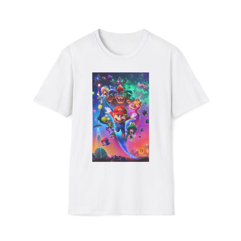 White Super Mario Galaxy inspired graphic t shirt featuring a colorful cosmic space themed design with a classic platform hero flying through a vibrant galaxy environment surrounded by stars planets and whimsical characters. The shirt is displayed flat showing the full front graphic print on a Gildan 64000 softstyle tee. The bright game inspired artwork captures the fun space adventure aesthetic loved by retro gaming fans.