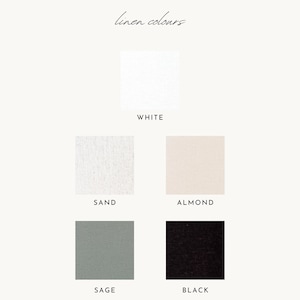 a color swatch with five different fabric colors: white, sand, almond, black, and sage.