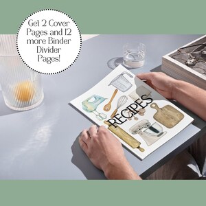 May include: A person is holding a white magazine with the word "RECIPES" printed in black. The magazine features watercolor illustrations of kitchen tools and appliances, including a rolling pin, a whisk, a measuring cup, a wooden cutting board, and a stand mixer.
