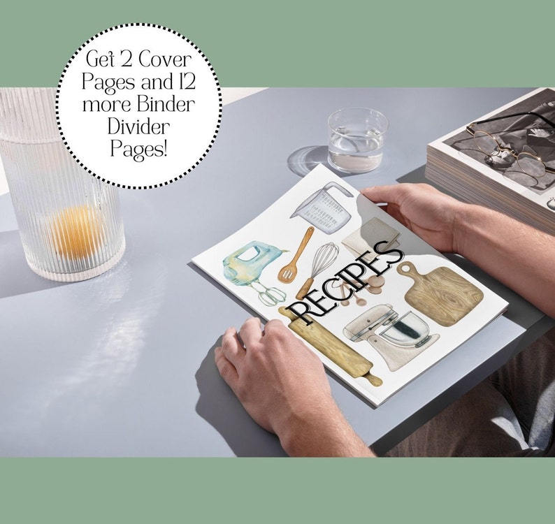 May include: A person is holding a white magazine with the word "RECIPES" printed in black. The magazine features watercolor illustrations of kitchen tools and appliances, including a rolling pin, a whisk, a measuring cup, a wooden cutting board, and a stand mixer.