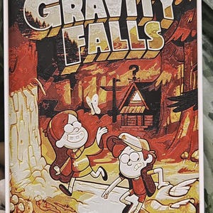 May include: A vintage-style poster for the Disney show "Gravity Falls". The poster features the show's title in a retro font, with a red, orange, and yellow color scheme. The poster also features the show's main characters, Dipper and Mabel Pines, standing in front of a mysterious cabin in the woods.