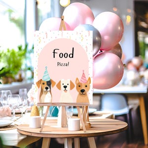 May include: A pink and white sign with the words "Food Pizza!" on it. The sign is decorated with confetti and three cartoon dogs wearing party hats. The sign is on a wooden easel.