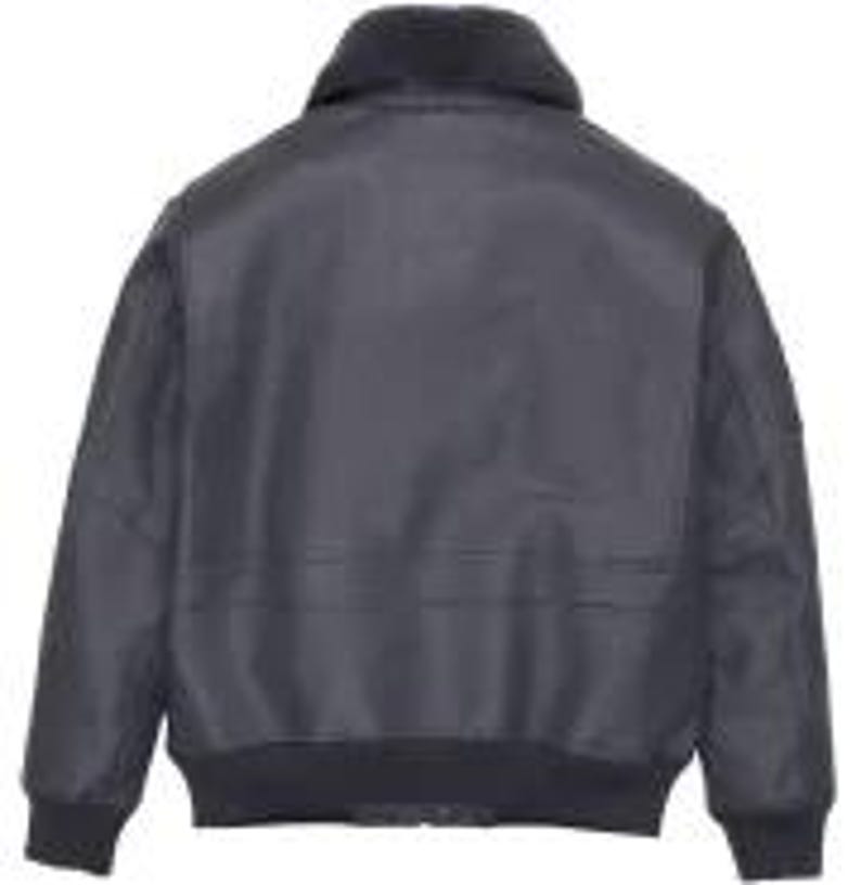 May include: A dark grey bomber jacket with a black faux fur collar and ribbed hem and cuffs. The jacket features a zip closure and two front pockets. The jacket is made of a durable, water-resistant material.