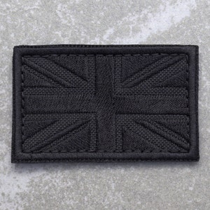 May include: Black embroidered Union Jack patch with a stitched border.