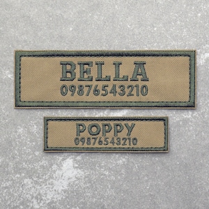 May include: Two tan and green embroidered patches with the names "BELLA" and "POPPY" and the phone number "09876543210" on a grey background.