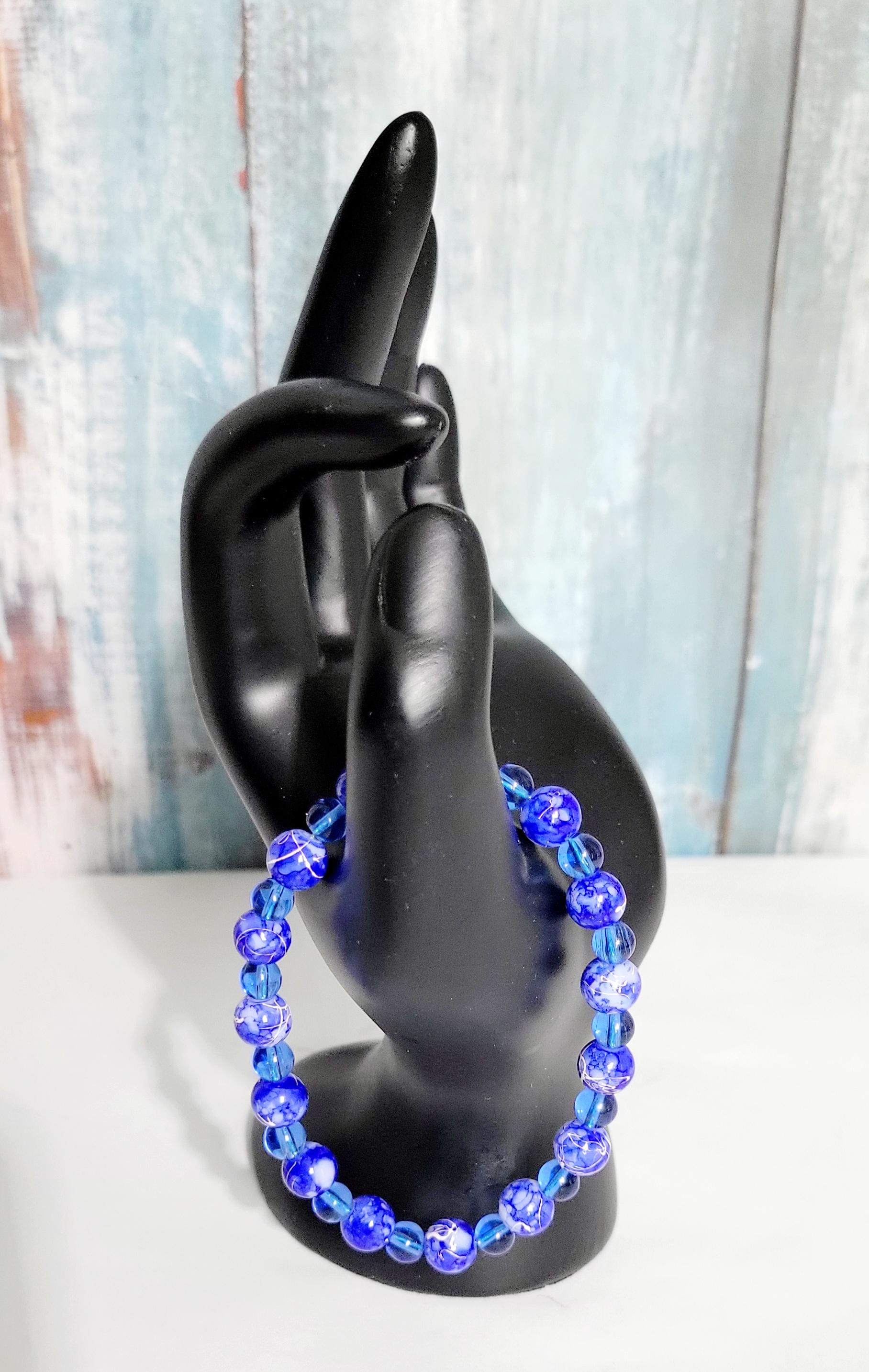 Hand crafted blue and white acrylic bead and translucent blue glass beaded bracelet