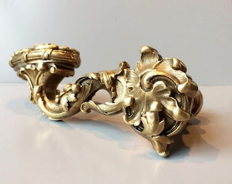 Set of handmade door handles. Cast bronze. Richly decorated with floral ornaments typical of the Louis XV style.