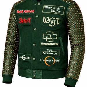 May include: Dark green varsity jacket with studded sleeves and band patches. Patches include "Iron Maiden", "Slipknot", "Wave-Gotik-Treffen", "Rammstein", "The Cure", "Field of Nephilim", and "A Perfect Circle". The jacket has a button-up front and a ribbed collar and cuffs.