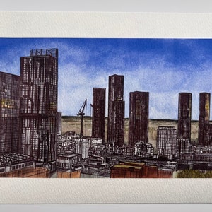 May include: Watercolor cityscape painting featuring a skyline of tall, dark buildings under a blue sky. A construction crane is visible. The artwork is on textured paper, with a focus on architectural details.