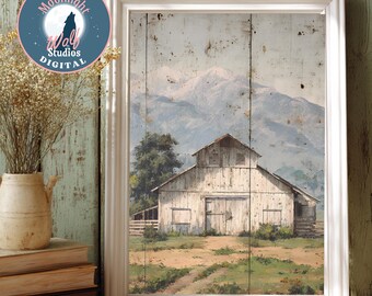 May include: A framed print featuring a rustic barn scene with a white barn, a dirt path, and a mountain backdrop. The print is in a white frame and has the text "JPGE Moonlight Wolf Studios DIGITAL" in a circular logo.