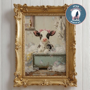 May include: A framed print of a cow in a bathtub, surrounded by bubbles. The cow has black and white markings and a pink bow. The ornate gold frame adds a touch of elegance to the artwork. The print is from JPGE Moonlight Wolf Studios Digital.