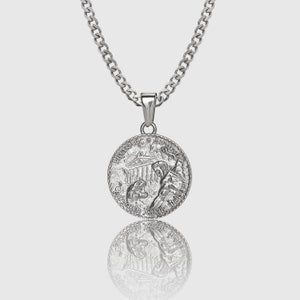 May include: Silver chain necklace with a round pendant featuring a detailed image of a Greek temple and a figure holding a torch. The pendant is inscribed with the words "Honor, Inc. Ad Verso" and "Auxilium Meum A Domino".