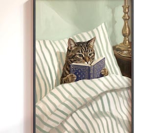 May include: Framed art print featuring a tabby cat reading a book in bed. The cat is nestled under a striped blanket and pillow, holding a blue book. The artwork has a vintage aesthetic, with soft colors and a warm, inviting atmosphere.