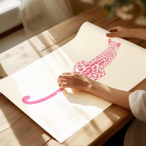 Trendy Pink Leopard Wall Art Print featuring a bold pink leopard on soft tones, perfect for girls rooms, preppy dorm decor, dopamine interiors, or jungle-inspired bedrooms. This funky animal print adds a stylish and vibrant touch to your apartment or teen room decor. Ideal for fans of maximalist wall art, aesthetic animal posters, or unique pink bedroom art. A standout piece that blends fashion vibes with wild, bold energy.