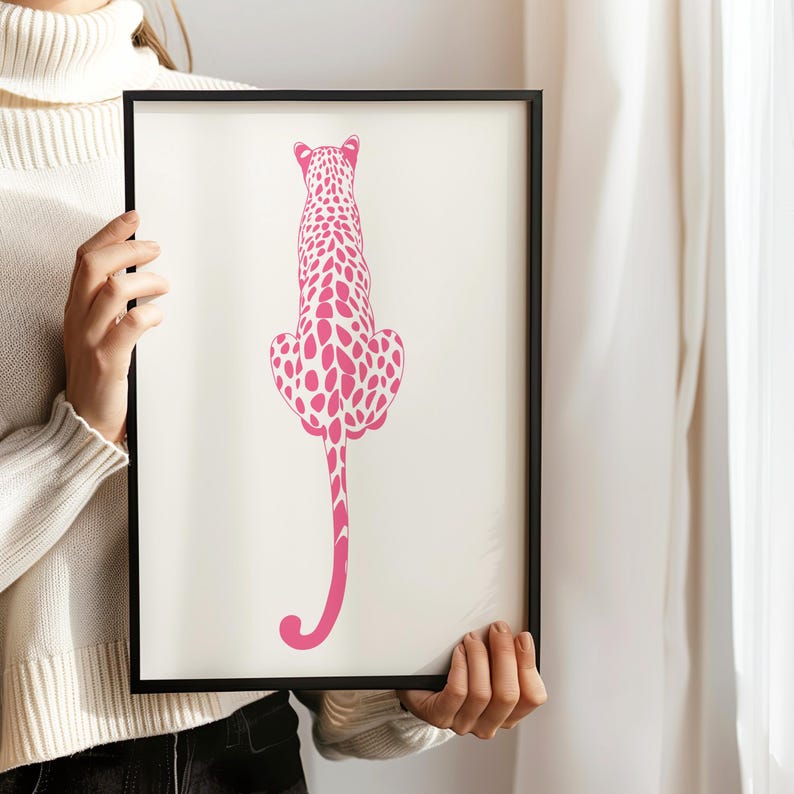 Trendy Pink Leopard Wall Art Print featuring a bold pink leopard on soft tones, perfect for girls rooms, preppy dorm decor, dopamine interiors, or jungle-inspired bedrooms. This funky animal print adds a stylish and vibrant touch to your apartment or teen room decor. Ideal for fans of maximalist wall art, aesthetic animal posters, or unique pink bedroom art. A standout piece that blends fashion vibes with wild, bold energy.