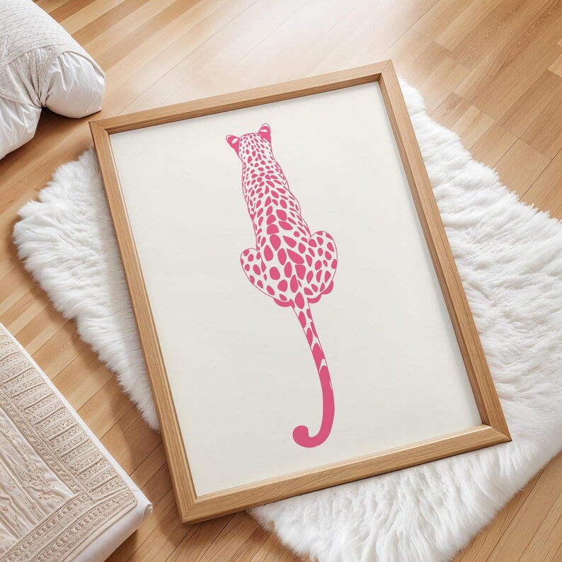 Trendy Pink Leopard Wall Art Print featuring a bold pink leopard on soft tones, perfect for girls rooms, preppy dorm decor, dopamine interiors, or jungle-inspired bedrooms. This funky animal print adds a stylish and vibrant touch to your apartment or teen room decor. Ideal for fans of maximalist wall art, aesthetic animal posters, or unique pink bedroom art. A standout piece that blends fashion vibes with wild, bold energy.