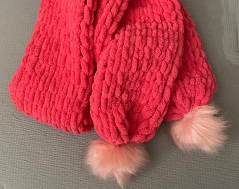 Hand-knitted scarf with faux fur pompoms