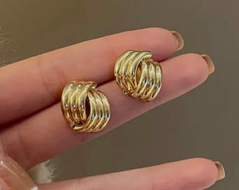 Gold twisted clip on earrings