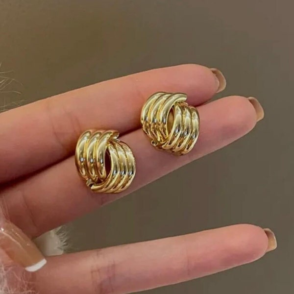 Gold twisted clip on earrings