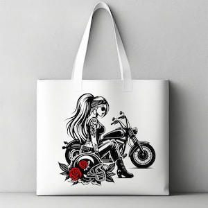 May include: A white tote bag with a black and white illustration of a woman riding a motorcycle. The woman is wearing a bandana, sunglasses, and a leather jacket. She is holding a helmet in her left hand. There are red roses on the ground near the motorcycle.