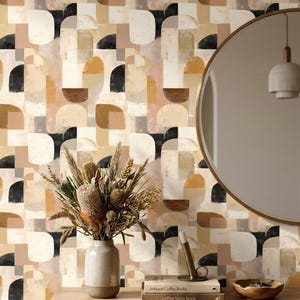 May include: Wallpaper featuring a repeating geometric pattern of semicircles and rectangles in shades of black, tan, cream, and brown. The design includes a light-colored vase with dried flowers, a candle holder, two books, and a wooden bowl.